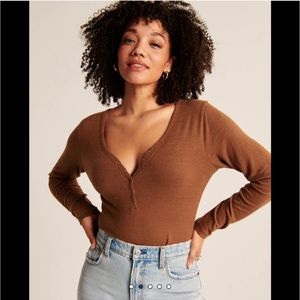 Abercrombie & Fitch Long-Sleeve Cozy Henley
Bodysuit in Orange Spice